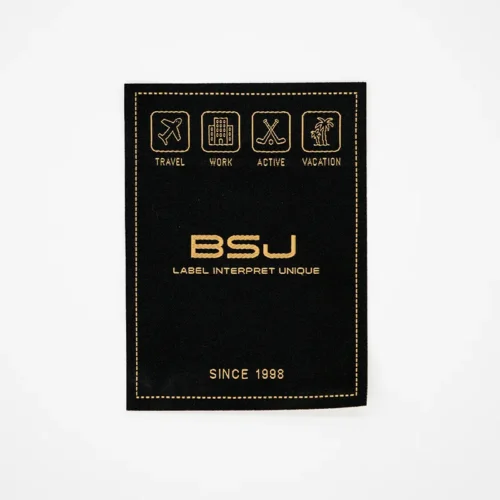 Étiquettes tissées à coudre avec logo jaune sur fond noir
