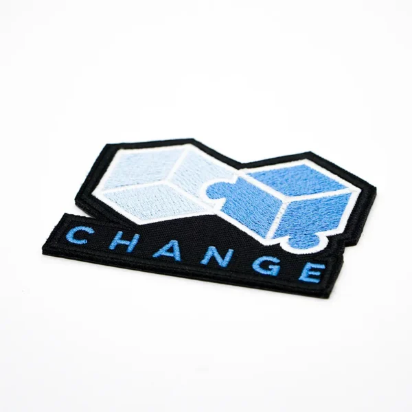 Creative Backing for Embroidery Patches with “CHANGE” Text - Imagen 3