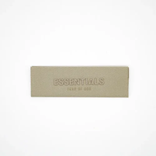 Texture d'étiquette tissée avec texte imprimé en silicone